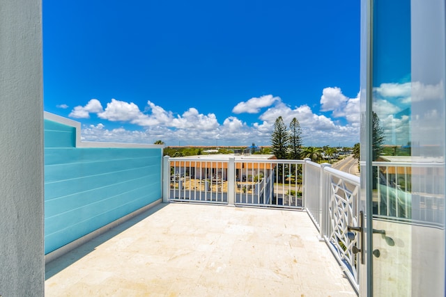 view of patio featuring a balcony