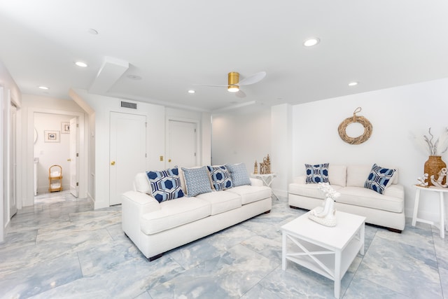 living room with ceiling fan and light tile patterned floors