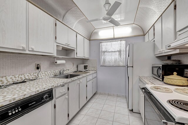 kitchen with light tile floors, ceiling fan, tasteful backsplash, white appliances, and sink