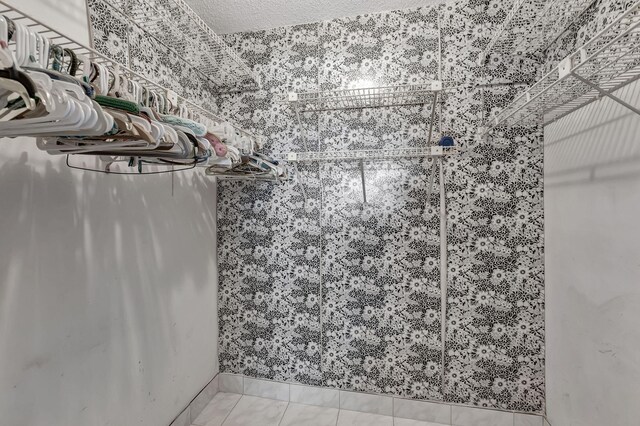 bathroom with walk in shower, toilet, ceiling fan, a textured ceiling, and vanity