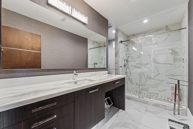 bathroom featuring tile flooring, a shower with shower door, and vanity