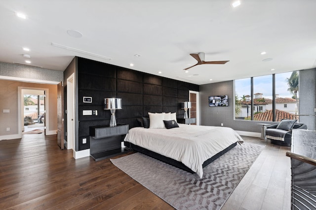 bedroom with ceiling fan and dark wood-type flooring