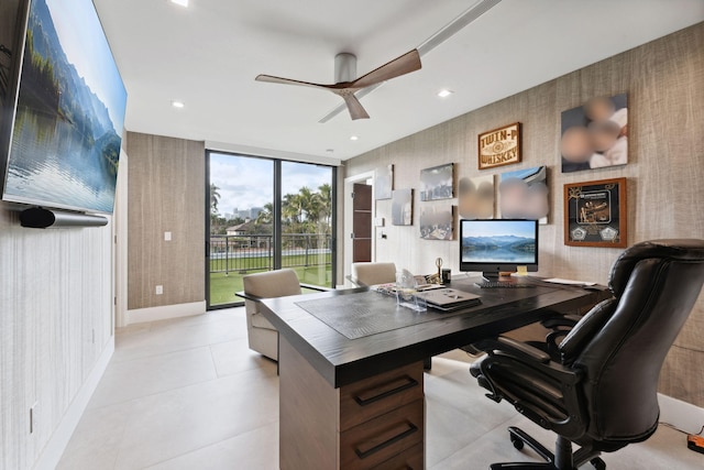 tiled office with ceiling fan and a wall of windows