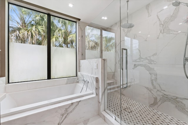 bathroom with plenty of natural light, plus walk in shower, and tile floors