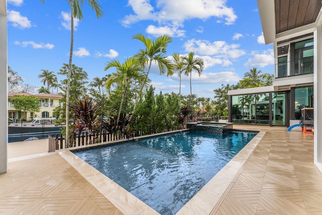 view of swimming pool with a patio