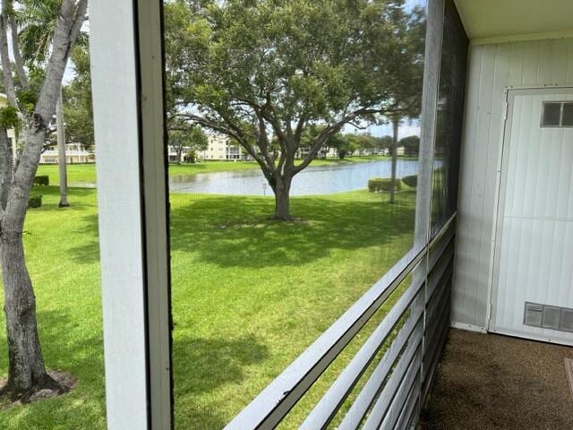 doorway to outside featuring a water view