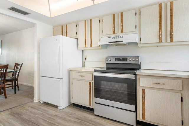 kitchen featuring electric stove, white refrigerator, light hardwood / wood-style floors, and custom exhaust hood