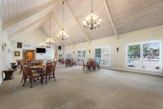 carpeted dining room featuring high vaulted ceiling, beam ceiling, a chandelier, and a wealth of natural light