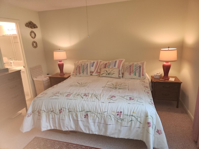 bedroom with carpet flooring and ensuite bathroom