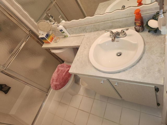 bathroom with vanity, tile patterned floors, and walk in shower