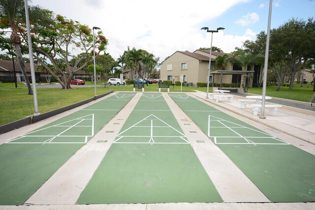 view of property's community with a yard