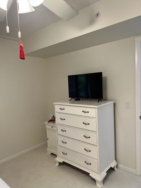 carpeted bedroom featuring a textured ceiling