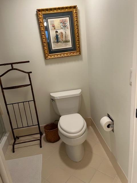 bathroom featuring tile patterned flooring and toilet