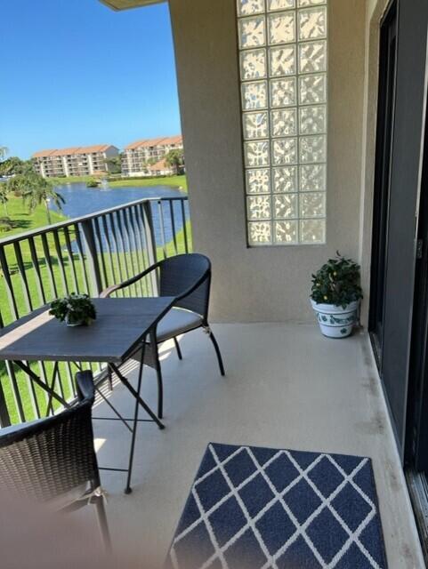 balcony featuring a water view