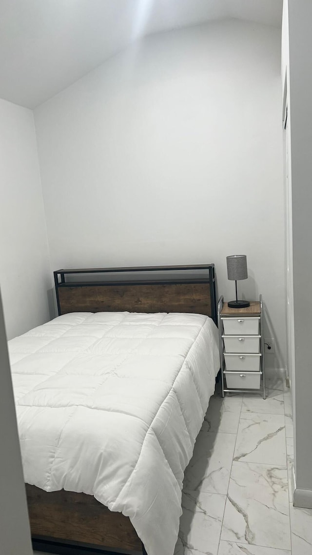 tiled bedroom with vaulted ceiling