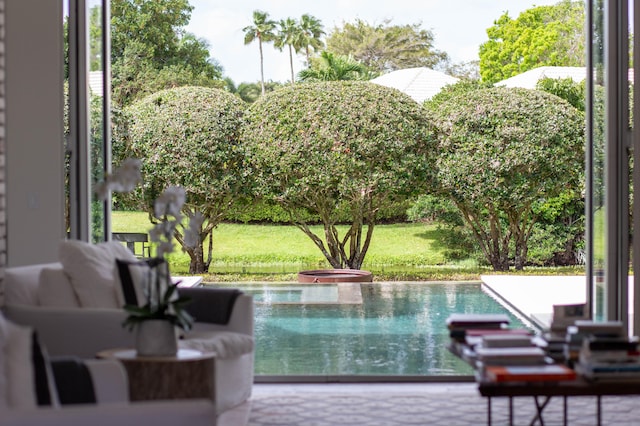 view of swimming pool featuring a jacuzzi