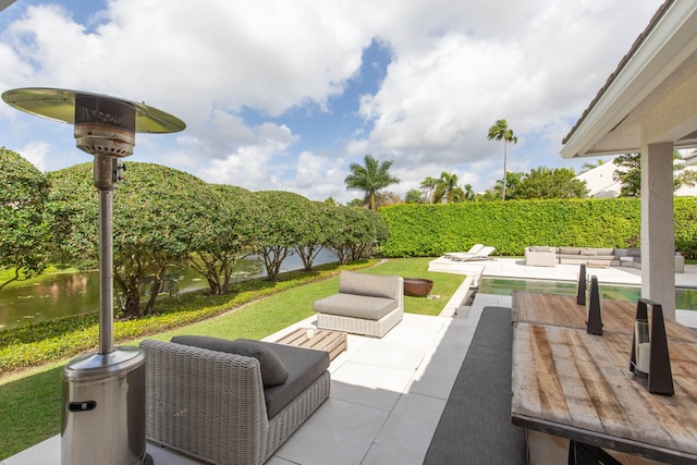 view of patio with a water view and a fenced in pool