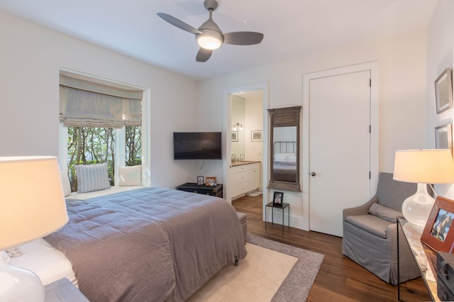 bedroom featuring hardwood / wood-style floors, ceiling fan, and ensuite bathroom