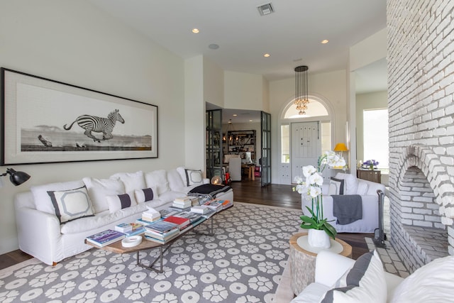 living room featuring a fireplace and hardwood / wood-style flooring