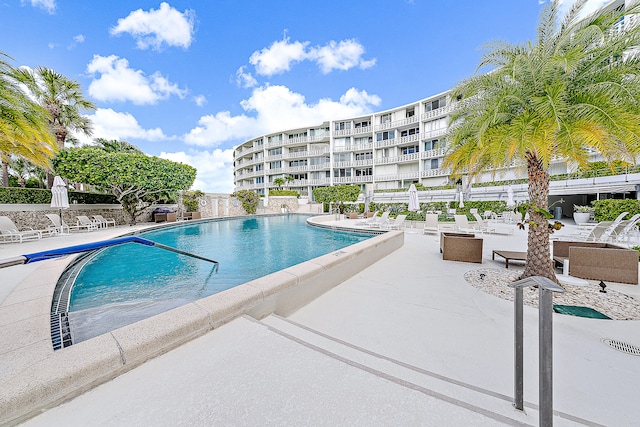 view of swimming pool with a patio area