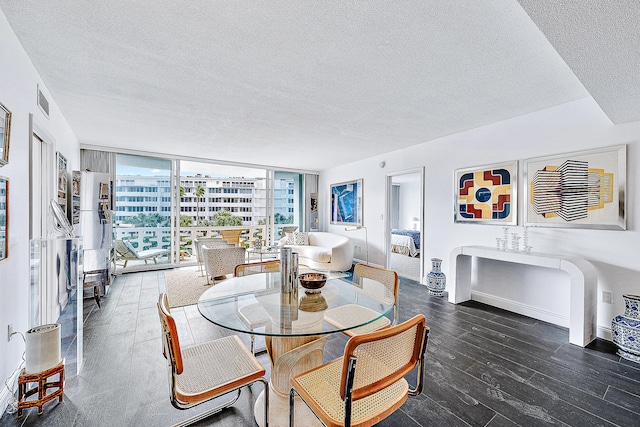 dining room with floor to ceiling windows, a textured ceiling, and dark wood-type flooring