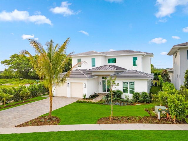 mediterranean / spanish-style home with a front lawn