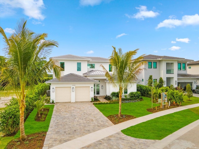 mediterranean / spanish-style house featuring a front lawn