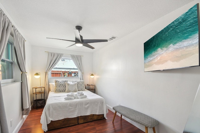 bedroom featuring dark hardwood / wood-style flooring and ceiling fan