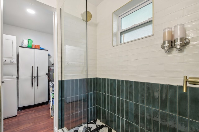 bathroom featuring tiled shower and hardwood / wood-style flooring