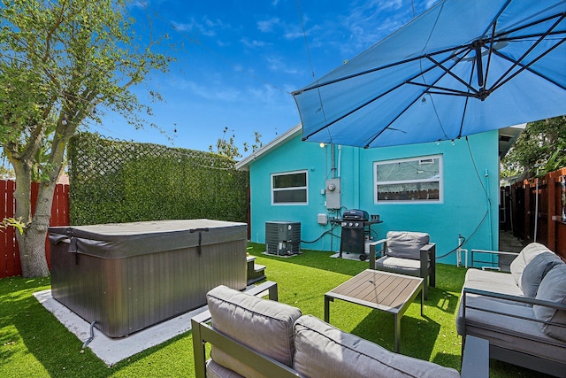 exterior space featuring central air condition unit, a lawn, outdoor lounge area, and a hot tub