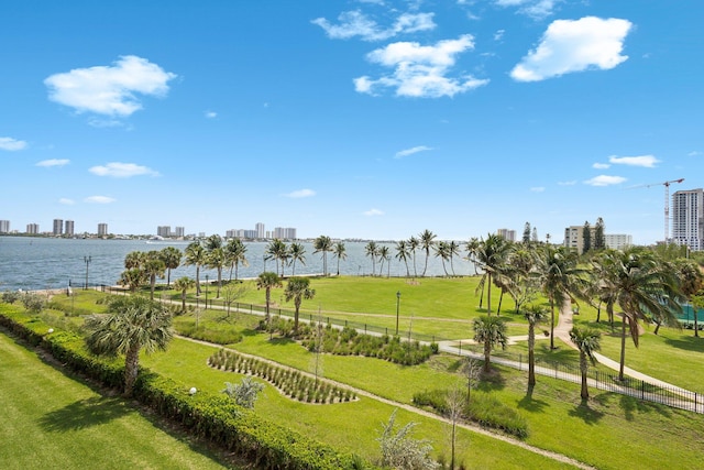 view of home's community featuring a yard and a water view