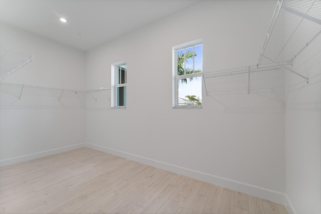 walk in closet featuring light hardwood / wood-style floors