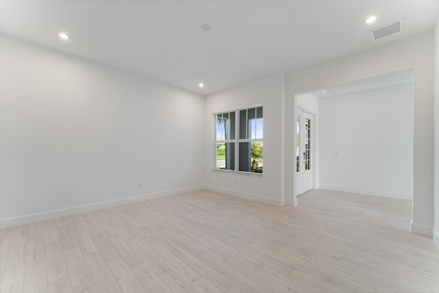 unfurnished room featuring light hardwood / wood-style floors