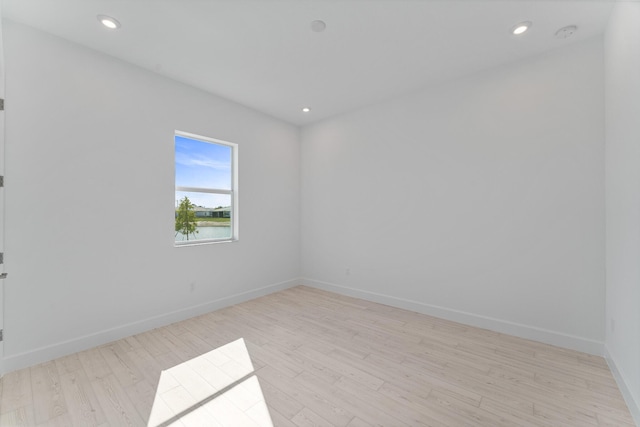 spare room with light wood-type flooring