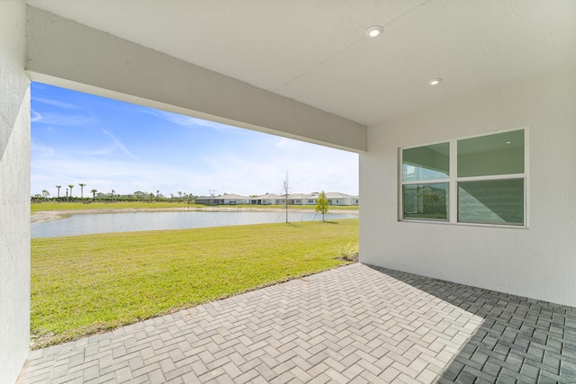 view of patio / terrace featuring a water view