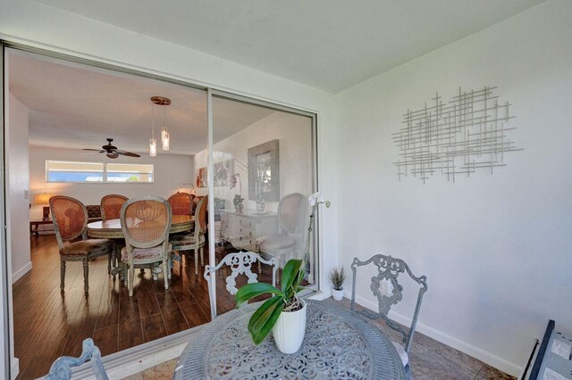 dining room with wood-type flooring and ceiling fan