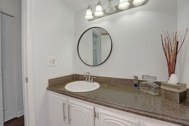 bathroom featuring hardwood / wood-style flooring and vanity