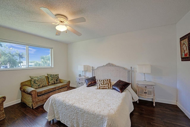 bedroom with ceiling fan, a textured ceiling, and dark wood-type flooring