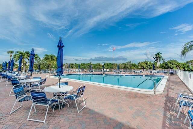 view of swimming pool featuring a patio area