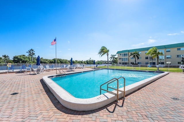 community pool featuring fence