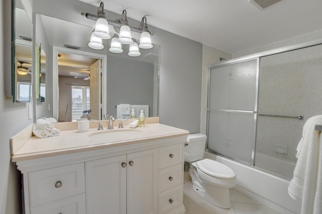 full bathroom featuring enclosed tub / shower combo, tile patterned flooring, toilet, vanity, and ceiling fan