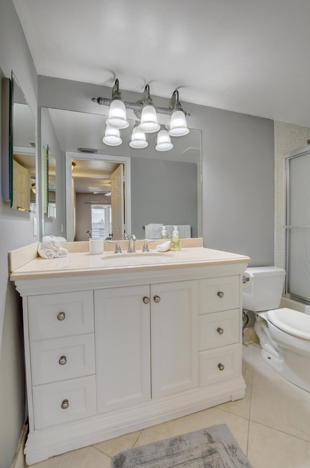 bathroom with tile patterned floors, toilet, and vanity