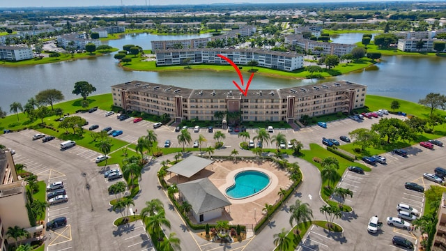 birds eye view of property with a water view