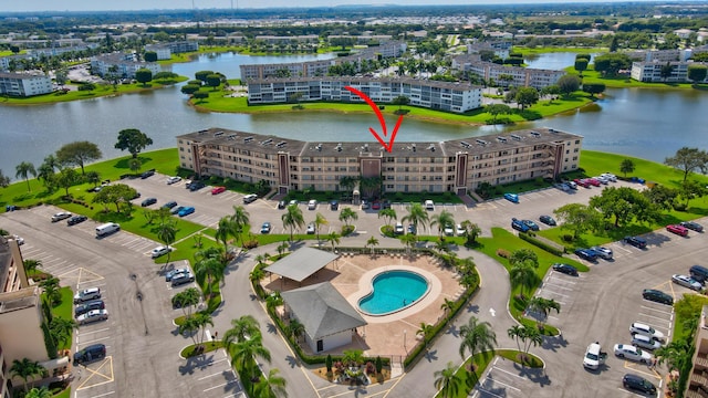 birds eye view of property featuring a water view