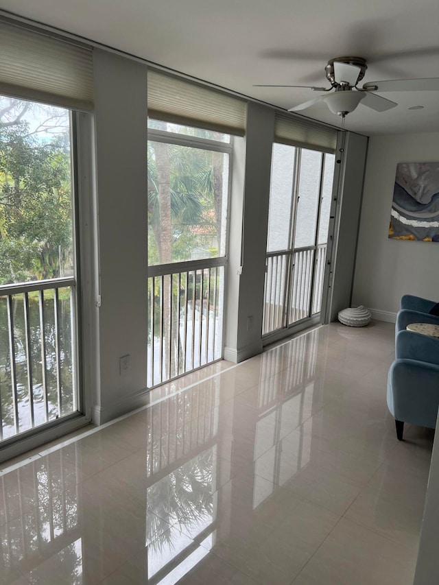 living room with a wealth of natural light and light tile patterned floors