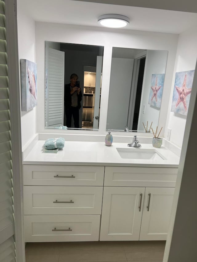 bathroom with vanity and tile patterned floors