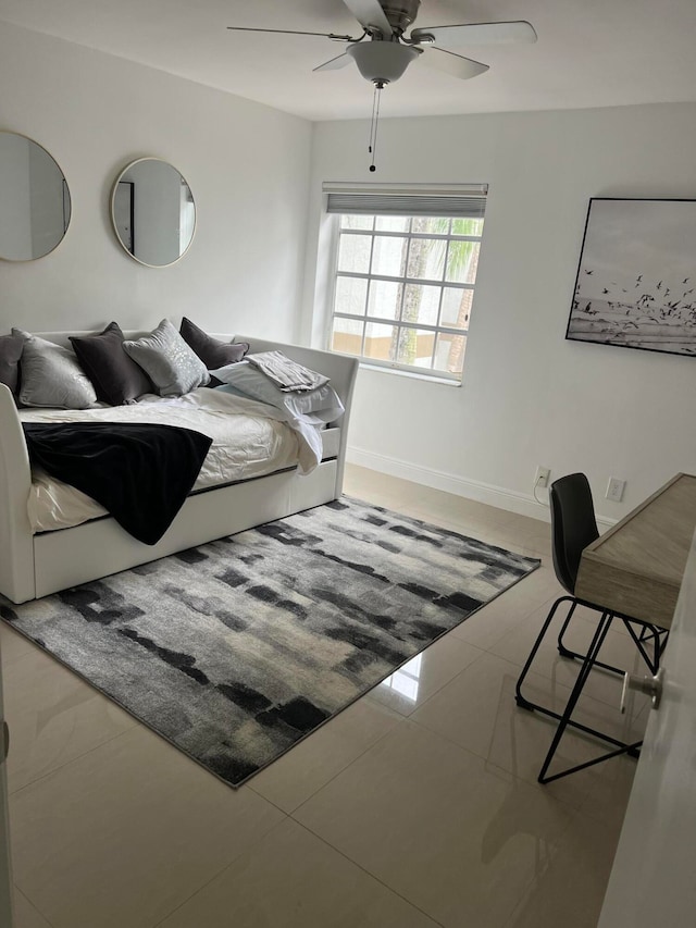 bedroom featuring tile patterned flooring and ceiling fan