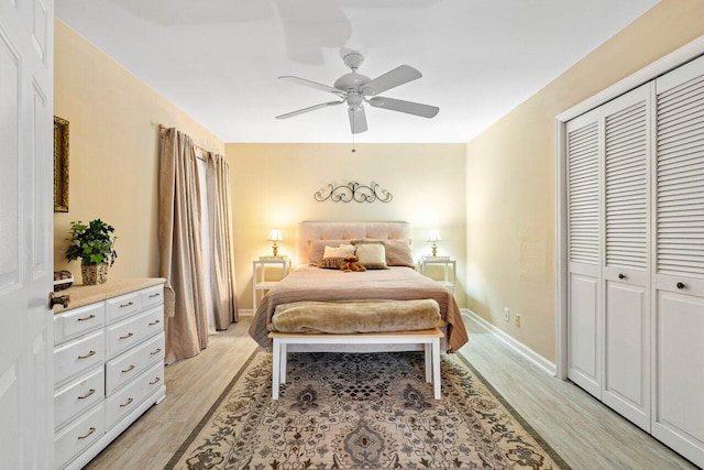 bedroom featuring a closet, ceiling fan, and light wood-type flooring