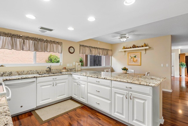 kitchen featuring kitchen peninsula, ceiling fan, white cabinets, white dishwasher, and dark wood-type flooring