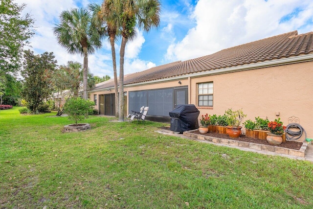 view of yard featuring an outdoor fire pit